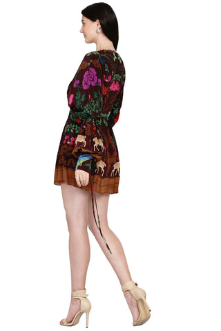 Back look of brown printed dress with rich accents, V-neckline embellished with fabric loops, and exaggerated draped sleeves — perfect for summer brunches or daytime occasions.