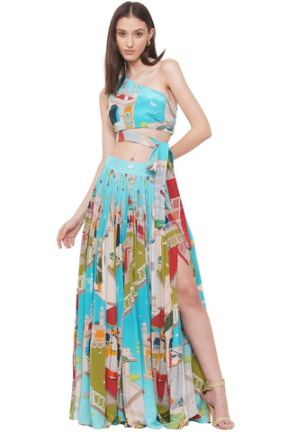 One-shoulder hand-embroidered crop top with attached belt, paired with a crepe statement slit skirt featuring exaggerated flare -a chic and versatile outfit perfect for Resort, Vacation and evening wear. Designed by Limerick.