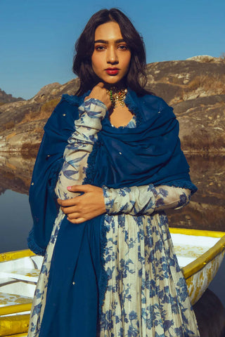 A chudi sleeved bird print anarkali in indigo is pefect dress for festive or wedding ceremonies. An indian designer dress designed by Paulmi and Harsh.