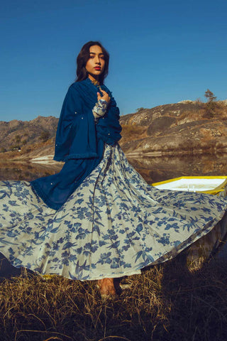 A chudi sleeved bird print anarkali in indigo is an indian designer dress designed by Paulmi and Harsh. It is pefect dress for festive or wedding ceremonies.