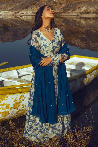 A chudi sleeved bird print anarkali in indigo and&nbsp;off–white potli detailing. It&nbsp;is paired with an indigo blue dupatta with crosia lace border, highlighted with sequence and moti. Designed by Paulmi and Harsh