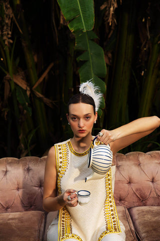 Effortlessly combine timeless elegance with contemporary style in our stunning Ivory Kurta with Border Embroidery and Hipster Pants Set. This versatile ensemble is perfect for any occasion, whether you’re dressing for a festive celebration or seeking a chic everyday look. Designed by Mona and Vishu.
