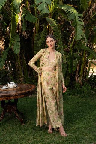 Reimagine tradition with a contemporary twist in our striking Green Banarasi Jacquard Jacket and Pant with Golden Tissue Bustier set. This fashion-forward ensemble combines the timeless elegance of Banarasi fabric with a modern silhouette and unexpected elements, making it a perfect outfit for the trendsetting woman. Designed by Mona and Vishu.
