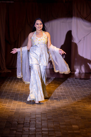 Model posing in Powder Blue Zari Halter Kurta with Colorful Floral Embroidery, Hipster Sharara, and Organza Dupatta Set at Australian Fashion Grandeur.