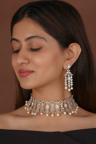 Classic white faux diamond necklace set in silver finish with matching earrings, suitable for weddings, parties, and both ethnic and western outfits.