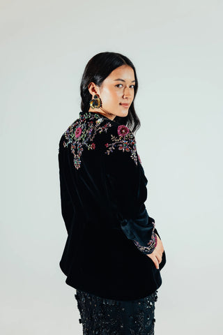 Elsa velvet blazer presented as a statement layer for party dressing, bringing refined tailoring and tactile velvet texture to contemporary evening and occasion outfits.
