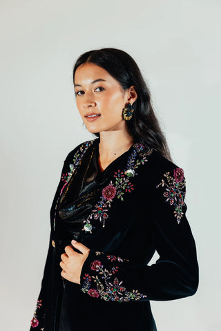 Close up look of the Elsa jacket highlighting its plush velvet texture and tailored construction, creating a polished statement layer for elevated occasion dressing.