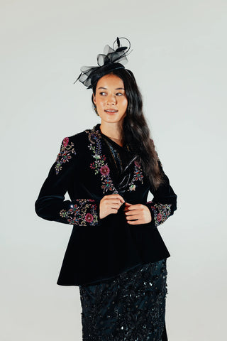 Elsa velvet blazer presented as a statement layer for party dressing, bringing refined tailoring and velvet texture to contemporary fashion and occasion outfits.