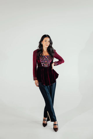 Musou Sasha flared hem blouse styled for an elegant evening outfit, offering a feminine tailored silhouette suited to dinner occasions, parties and special events.
