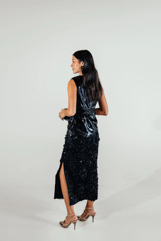 Back look of the Selene skirt highlighting its decorative floral detailing and dimensional finish, creating a refined statement piece for elevated feminine styling.