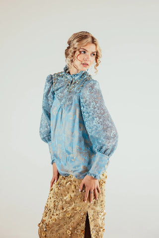 Close view of the Skyla top highlighting its satin fabric and delicate lace detailing, creating a refined feminine look suited to elevated occasion and pinterest style outfit.