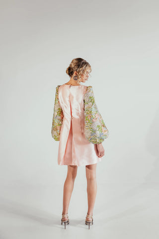 Back look of Musou Yuri brocade mini dress showing the refined silhouette and detailed fabric texture, ideal for elegant parties, occasions and contemporary designer dressing.