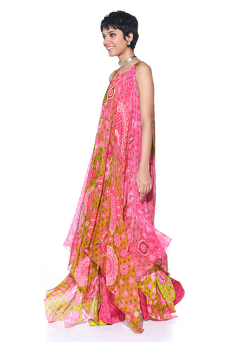 Side look of the sunset Orange High-Low Tunic with Hand Embroidery, Gulabi Pink Chevron Printed Pants.
