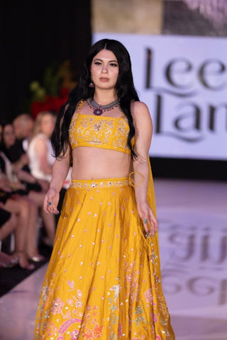 Yellow haldi lehenga set with pink, jari embroidery by Paulmi & Harsh, perfect for a bride’s Haldi ceremony and wedding celebrations.