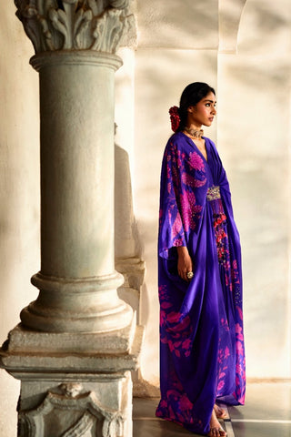 Side profile of the silk organza kaftan showcasing fluid drape and relaxed contemporary styling.