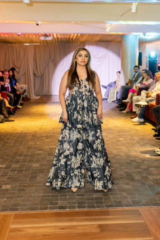 A navy blue peplum set in Paulmi and Harsh signature Roop flip bird print at australian fashion week. Indian designer at Australian fashion Grandeur runway.