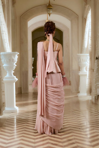 Back look highlighting the graceful fall of the georgette saree and the peplum’s refined craftsmanship, finished with a crystal-embellished tie-up belt for contemporary elegance.