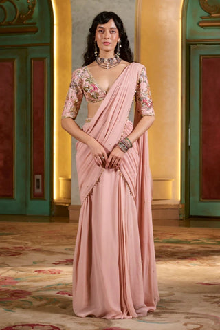 Romantic light pink pre-stitched cocktail saree with floral hand embroidery, lace details. Perfect for  Cocktail Parties, wedding reception, Dinner dates, Anniversaries. Designed by Paulmi and Harsh.