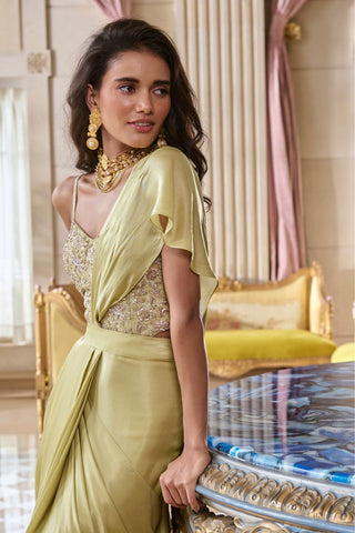 Side angle highlighting the structured corset silhouette, detailed zardozi embroidery on silver jacquard fabric, and the smooth fluid drape of the satin saree.