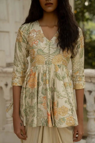 Woman wearing a floral dress with a blurred background