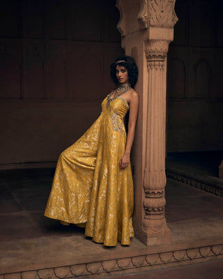 A self-woven Russian jacquard jumpsuit in a beautiful shade of yellow. It has delicate hand–embroidery of floral motifs on the pockets and yoke. Designed by Paulmi and Harsh