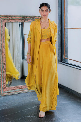This elegant yellow jacket set is strewn with beautiful florals on the blouse and jacket, in delicate cutwork embroidery. All rounder outfit for Resort Ready, brunch to soiree, vacation in style, gen-z glam, floaty and fierce and more. Designed by Paulmi and Harsh.