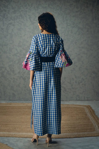 Back look of the Paulmi and Harsh Yutori Midi Dress displaying the uninterrupted floral print, clean tailoring and relaxed silhouette that create a timeless contemporary designer look.