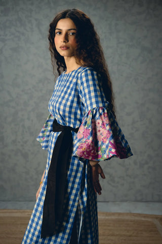 Close-up detail of the Yutori Midi Dress highlighting the intricate floral print, and bell sleeves.