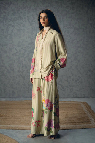 Aika botanical stripe outfit featuring a relaxed modal-silk shirt and matching pants, combining delicate floral patterning with an easy contemporary silhouette.