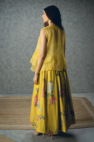 Back look of yellow skirt set styled with an optional pure organza shirt, adding an elegant sheer layer to the embroidered blouse and fitted skirt for elevated evening occasion dressing.