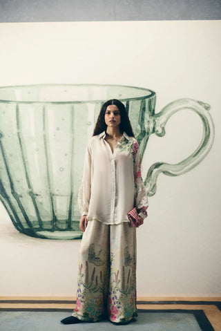 Elegant ivory Aika satin two-piece set styled as a sophisticated designer outfit, ideal for wedding guest dressing, festive celebrations, evening parties, receptions and special occasions.