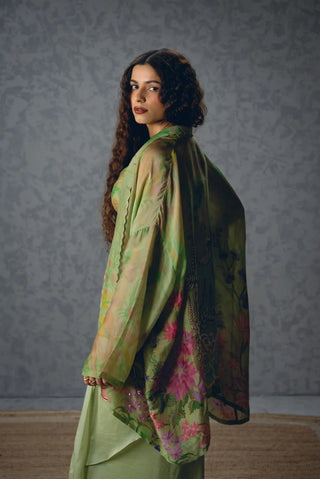 Stylish Cleo green floral skirt set features a relaxed jacket and fitted-waist wrap-around skirt, creating a chic contemporary designer outfit for cocktail parties and elegant soirees.