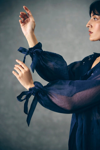 Close-up of the Nami jacket highlights intricate embroidery on lightweight pure organza, showcasing premium craftsmanship and sophisticated detailing for luxury designer fashion.