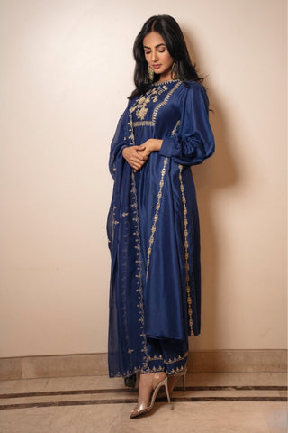 Designer electric blue chiniya silk kurta with antique gold anar motif hand embroidery on the yoke, paired with hand-embroidered detailed pants.