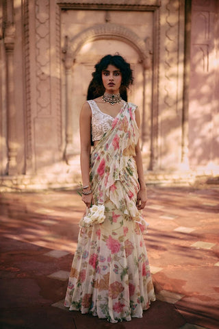 This exquisite, pre-draped saree is crafted from a light-as-air chiffon fabric and comes with a chintz embroidered blouse with zari and aari work lending an effortless allure to this drape. Styled for festive gatherings, wedding functions and cultural occasions. Designed by Paulmi and Harsh