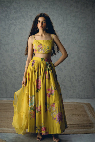 Women's Alina yellow designer skirt set showcases a fitted blouse and structured skirt with printed embroidery, offering a luxury outfit for festive and special occasions.
