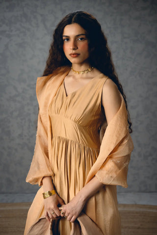 Nude Inaya designer dress styled with a delicate sheer pure organza jacket, creating a sophisticated Indian contemporary outfit perfect for wedding guests, festive occasions and luxury events.