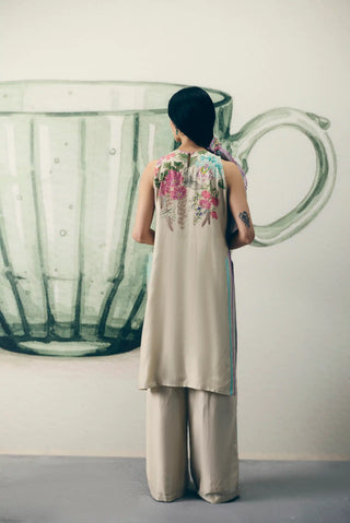 Back look of Ivory Shiro three-piece set featuring a floral printed embroidered tunic, fitted-waist pants with striped side patches and a pure organza scarf for festive dressing.