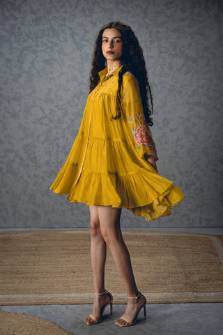 Chic mustard yellow short dress with relaxed loose-fit styling, printed sleeves and embroidered yoke, offering an elegant yet comfortable designer outfit for brunches, daytime parties and summer occasions.