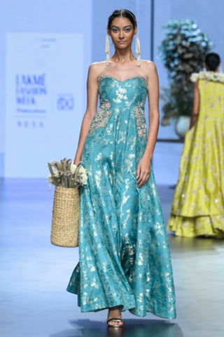 Designer fusion jumpsuit in blue jacquard fabric showcasing handcrafted embroidery and sophisticated evening wear appeal.