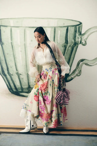 Stylish Alora off white floral skirt set pairs a relaxed embroidered shirt with a fitted yoke waistband skirt, creating a chic designer outfit for cocktail parties and soiree.