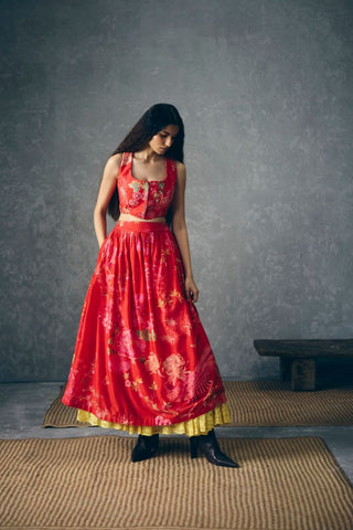 Elegant red two-piece outfit featuring printed embroidery, tailored waistcoat silhouette, and coordinated gathered skirt.