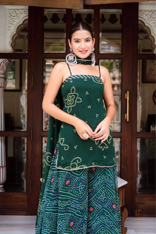 Elegant green georgette kurta set with bandhani print, includes palazzo and dupatta with cotton lining, suitable for daily wear and festive styling.