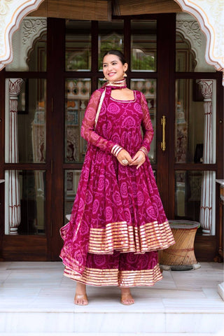 Traditional plum Bandhani georgette Anarkali set with gota patti work, cotton pants and georgette dupatta, fully stitched women’s ethnic wear for festive and wedding occasions.