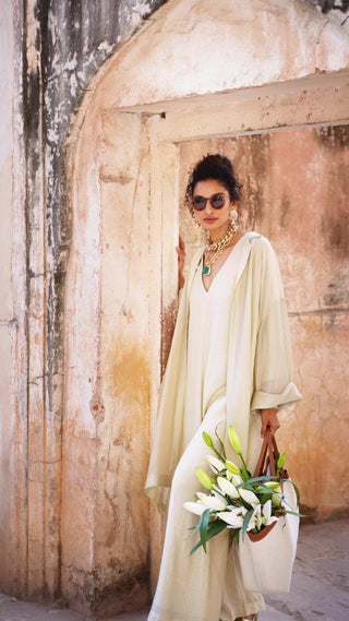 Indo Western Jumpsuit in an ivory silk linen fabric with jacket designed by Paulmi and Harsh. A perfect dress for a day out with family and friends, casual wear, picnic, beach, office wear. Designed by Paulmi and Harsh.