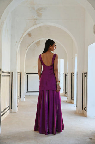 Back look of purple square neckline golden jaal embroidered sleeveless short ethnic kurta with palazzo and dupatta.