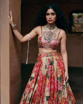 A close up look of the heavily hand-embroidery strappy blouse, and hand-embroidery print highlights on the lehenga.