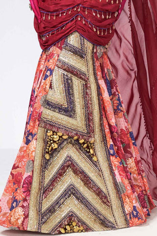 Cherry three-piece outfit featuring a cherry crepe skirt, embroidered blouse, and flowing organza drape.