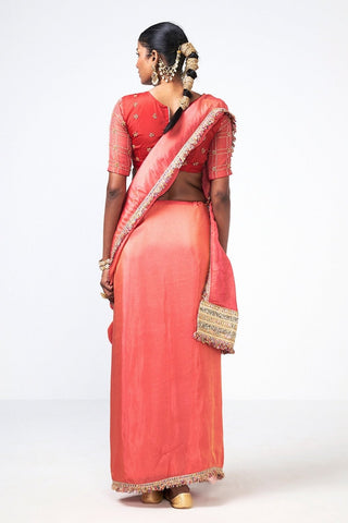 Back look of Coral Tales designer saree from Rishi and Vibhuti showcasing delicate floral embroidery, premium organza and tissue fabric, handcrafted zari border, tassel detailing, and an embroidered blouse, perfect for women's festive wear, celebrations, and traditional ceremonies.