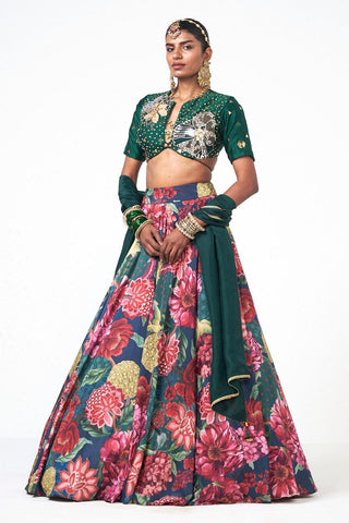 Crafted in luxurious crepe, dupion, and organza, the Corbet Tales Lehenga Set is a contemporary three-piece ensemble in a striking emerald-green hue. Intricate hand embroidery, a flowing silhouette, and a lightweight dupatta come together to create a look that is both sophisticated and celebration-ready.

Perfect for brides, bridesmaids, and wedding guests, it is an elegant choice for wedding celebrations, Mehendi and Sangeet nights, engagement parties, and other special occasions where making an unforgetta